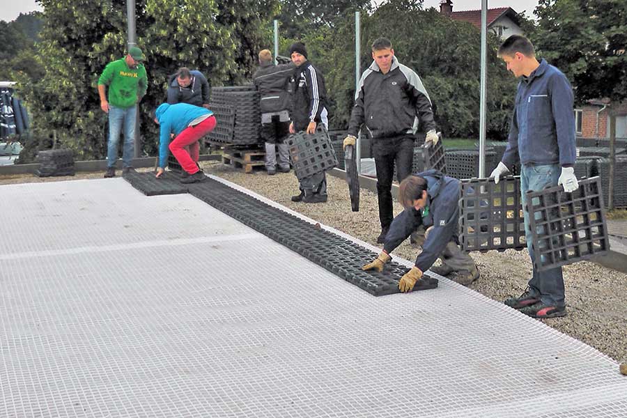 Step 2 in building the artificial turf pitch: Laying the TTE® system